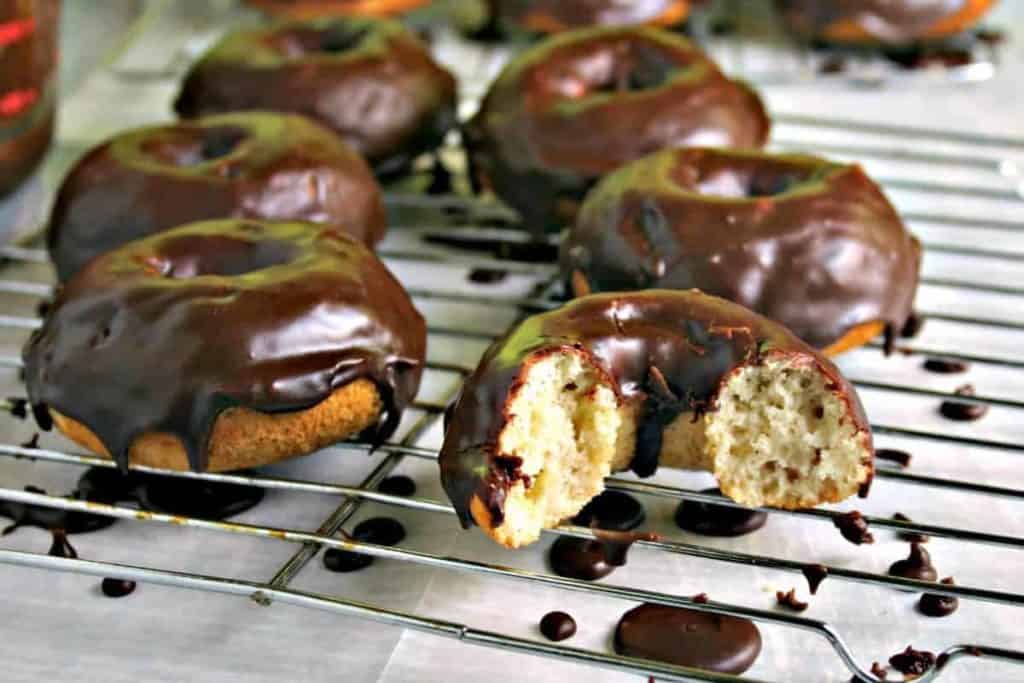 A chocolate covered donut on a wire rack, Mocha Glazed Baked Donuts
