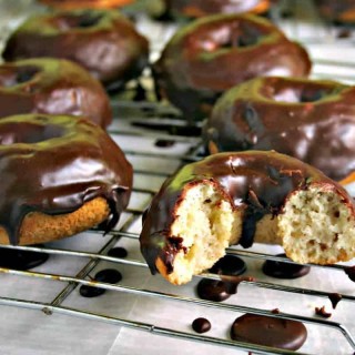 A chocolate covered donut on a wire rack, Mocha Glazed Baked Donuts