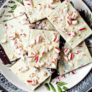 peppermint bark stacked on a holiday plate.