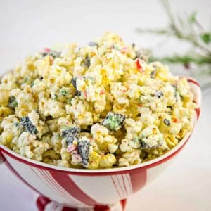 white chocolate peppermint popcorn in a festive bowl