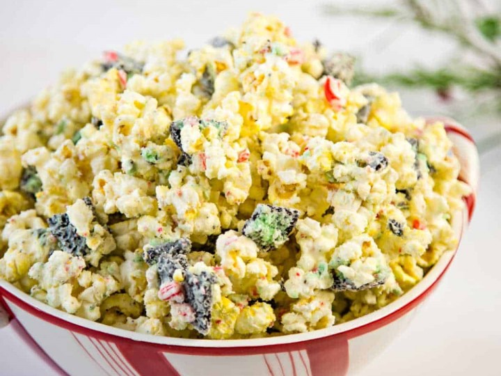 white chocolate peppermint popcorn in a festive bowl