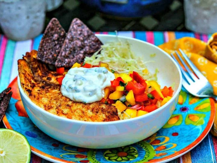 A bowl of food on a plate, with Fish Tacos