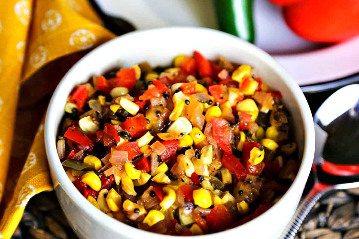 A bowl filled with chow chow, with Sweet potato and Ribs