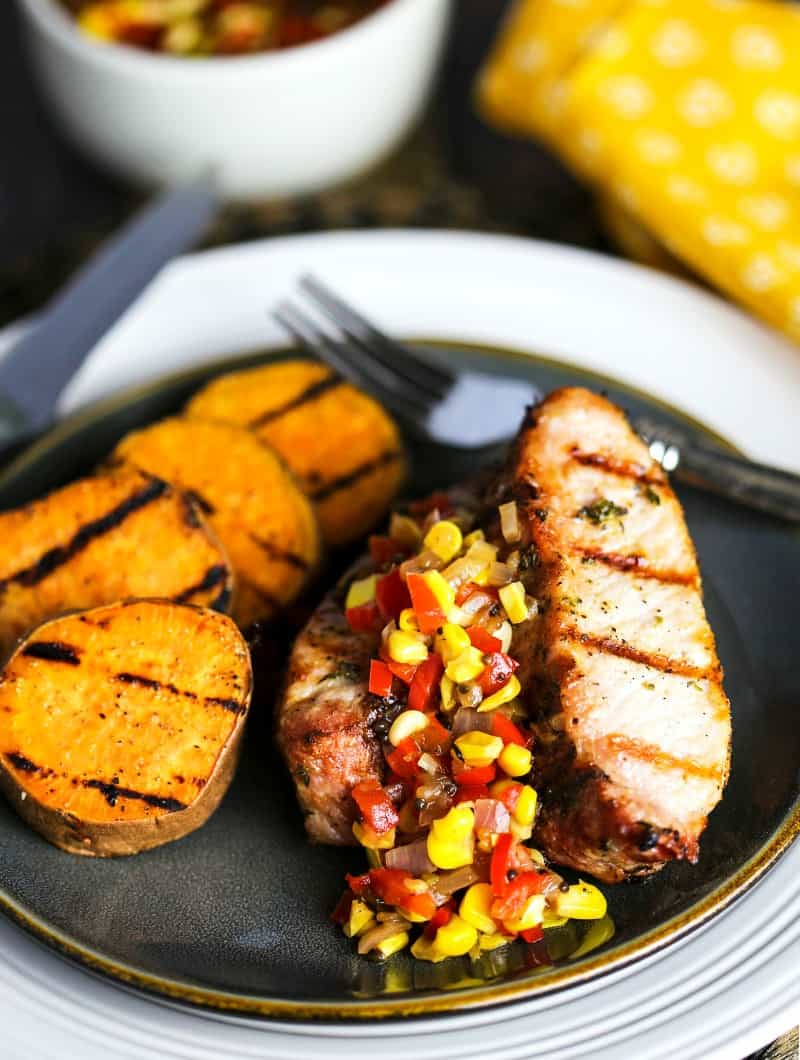 A plate of food, with Sweet potato and country style pork ribs