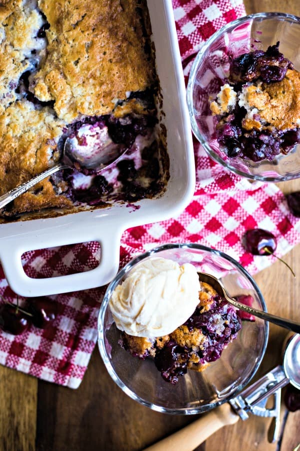 servings of fruit cobbler on a red checked table cloth