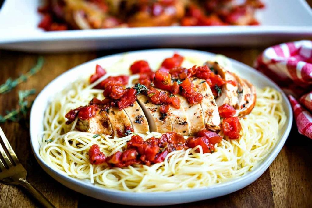 Slow Cooker Balsamic Chicken on a bed of angel hair pasta