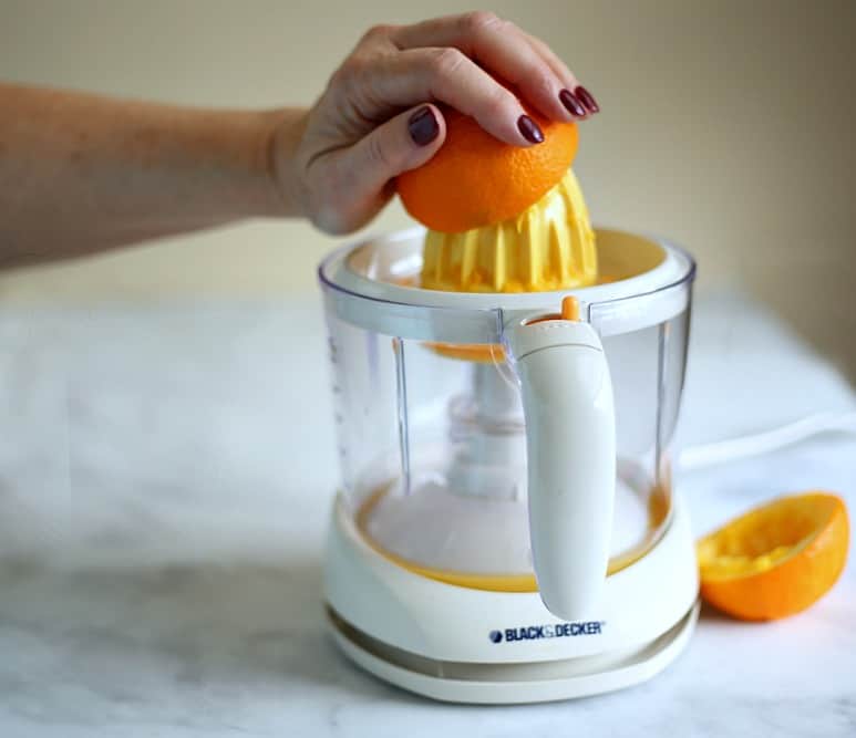 citrus juicer with oranges