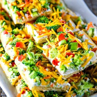 cool veggie pizza squares on a white serving tray