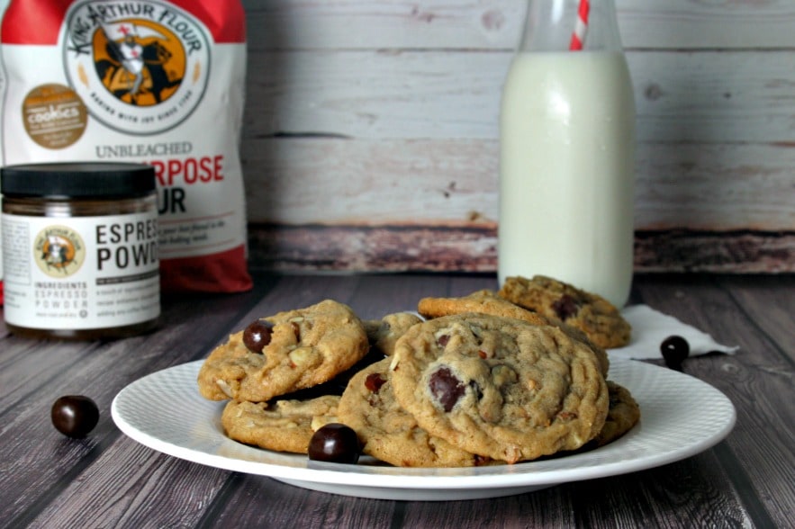 A plate of Espresso Coffee Bean Cookies sitting on top of a wooden table