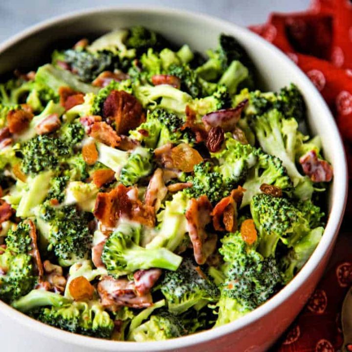 broccoli and bacon salad in a white bowl