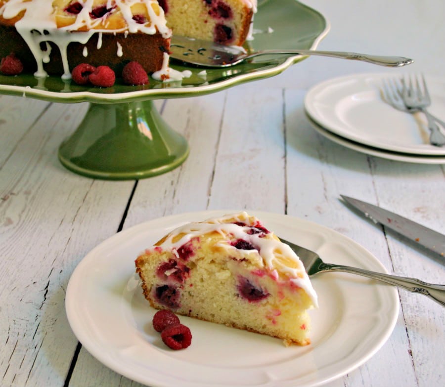 A piece of cake on a plate, with Raspberry Ricotta Cake