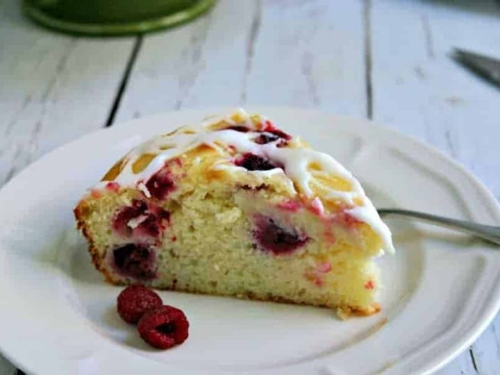 A piece of cake on a plate, with Raspberry Ricotta Cake