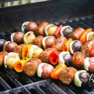 A close up of food on a grill, with Italian Skewers