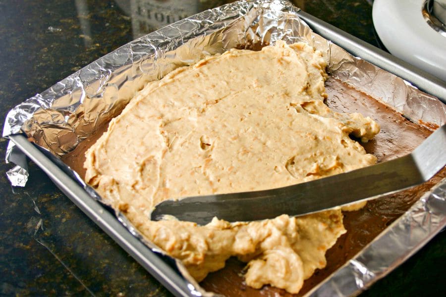 A pan filled with chocolate crust, and cheesecake filling