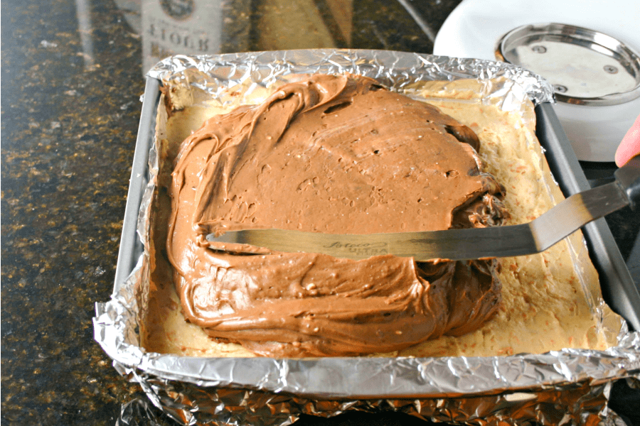 A pan filled with chocolate crust, and cheesecake filling