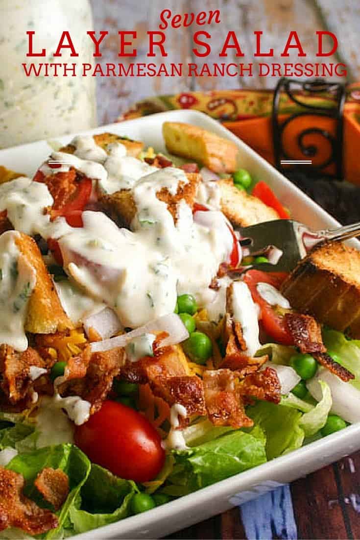 A bowl of food, with Seven-Layer Salad and Parmesan Ranch dressing