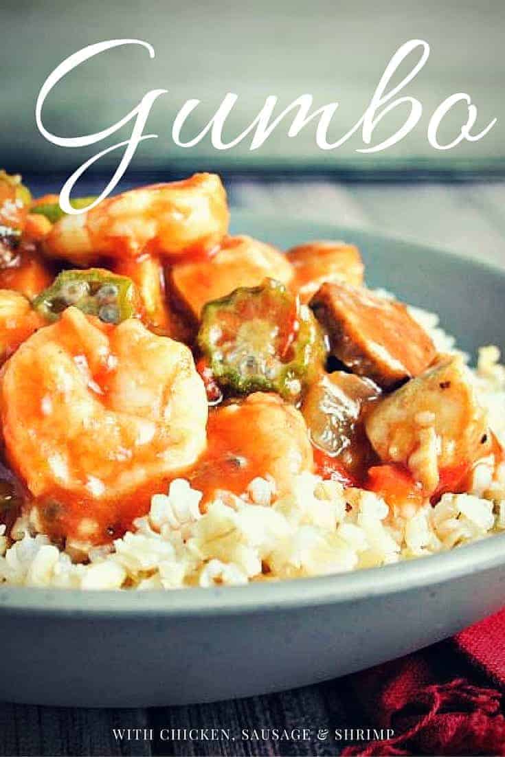 A bowl of food on a table, with Chicken, Sausage, and Shrimp Gumbo