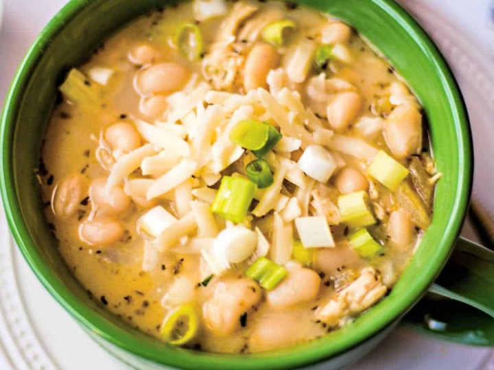 white chicken chili in a green soup bowl