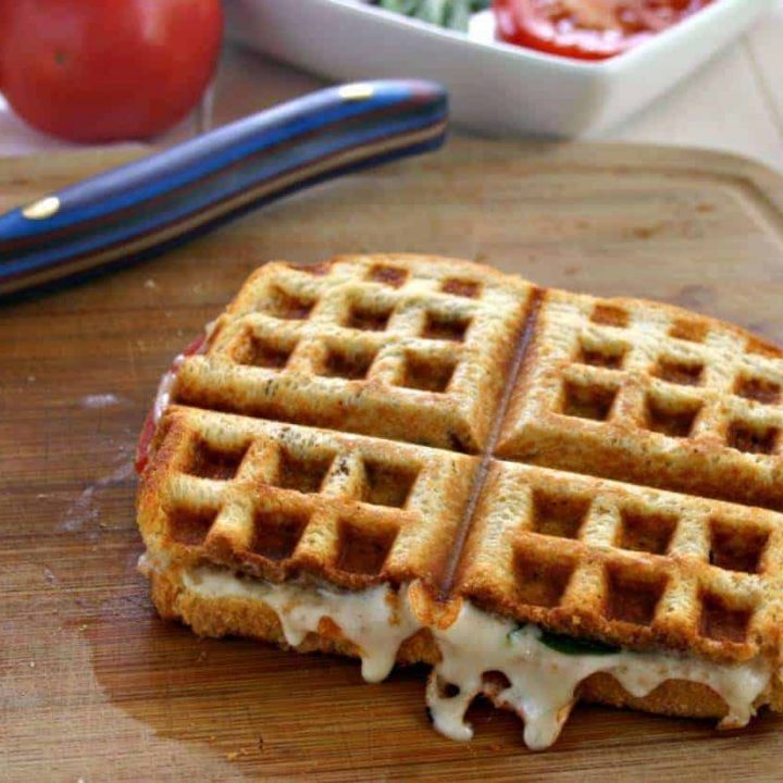 A Bruschetta Waffle Panini on a cutting board