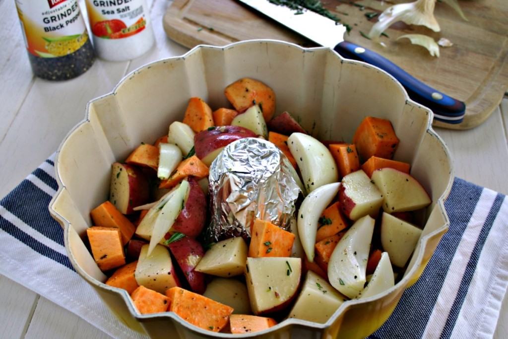 A Bundt pan filled with chinks of vegetables, with Rotisserie Chicken and roasted vegetables