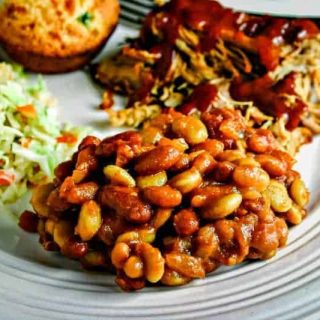 mixed baked beans on white plate