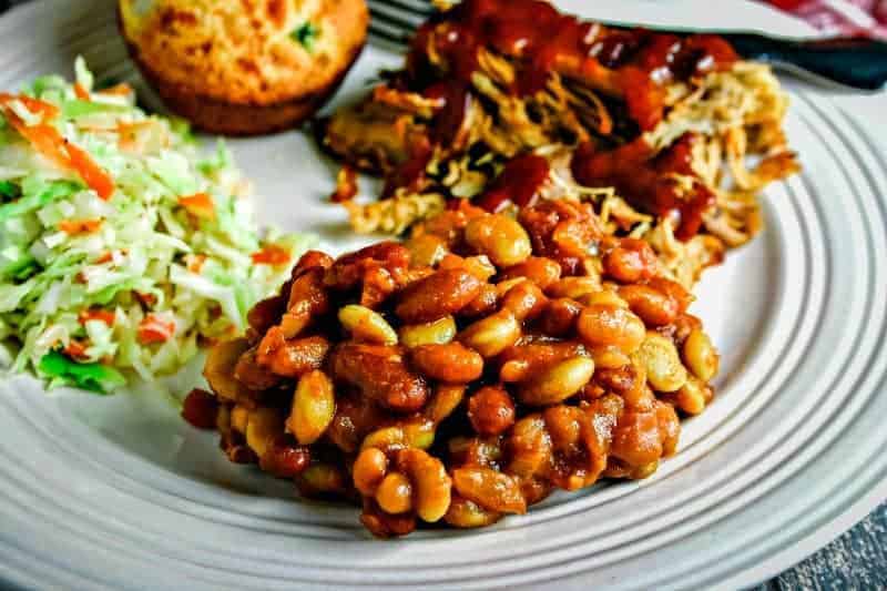 mixed baked beans on white plate