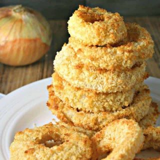 A close up of food on a plate, with Crispy Oven Baked Onion Rings