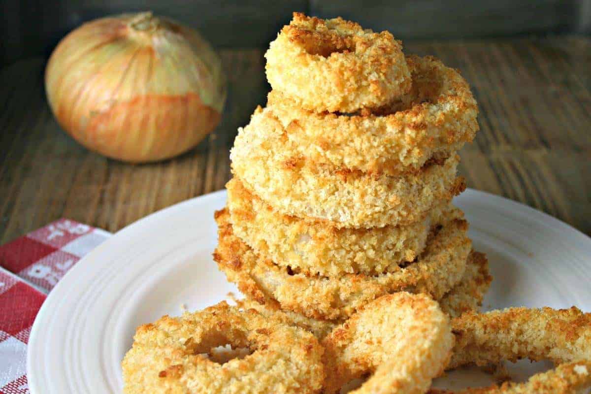 A close up of food on a plate, with Crispy Oven Baked Onion Rings