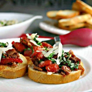 A plate of Roasted Red Pepper and Bacon Bruschetta on a table