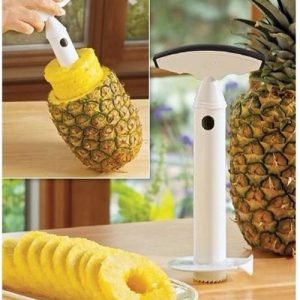 A pineapple corer in a pineapple