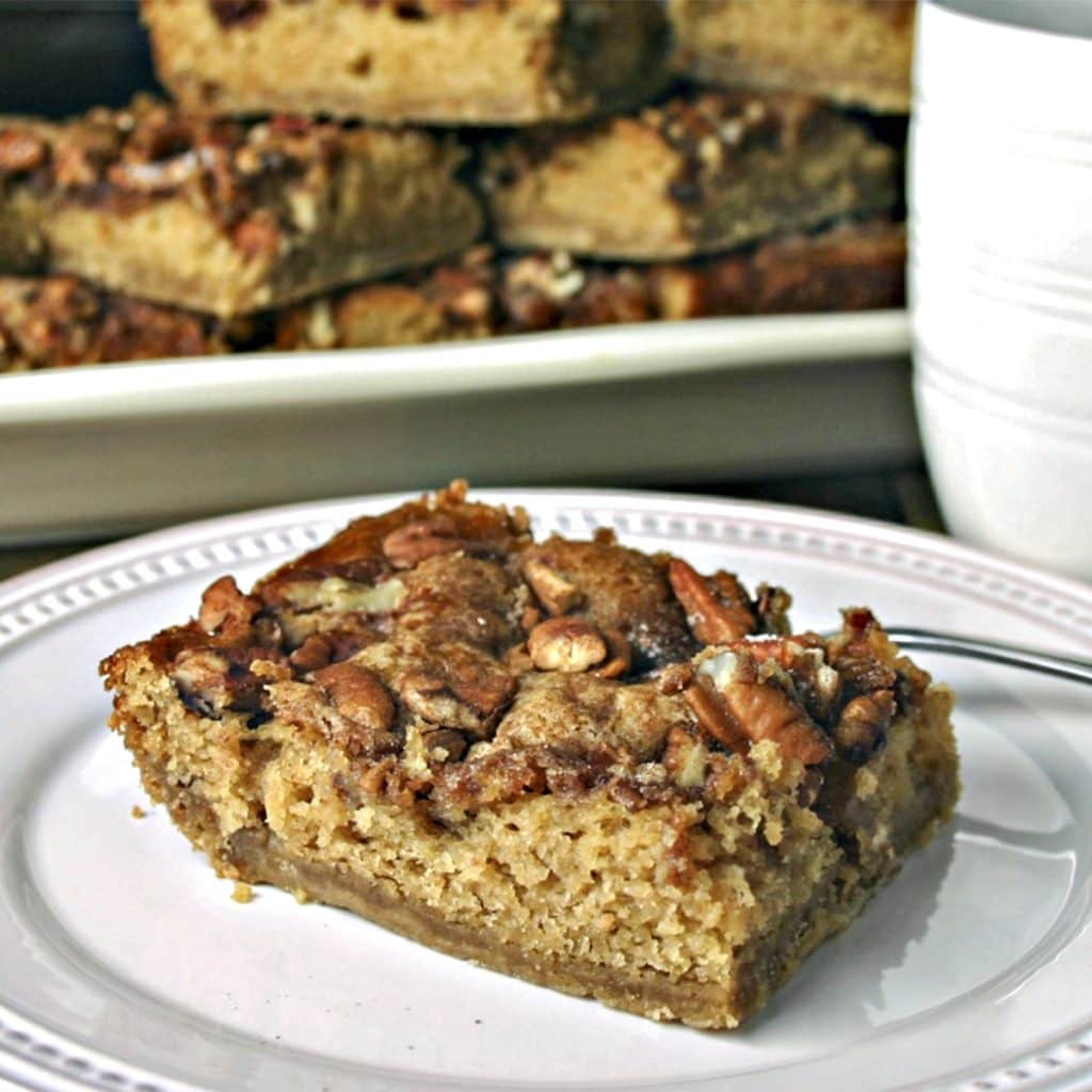 A slice of Brown Sugar Pecan Coffee Cake on a plate on a table