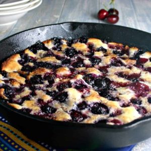 A cast iron skillet with Cherry Berry Cobbler