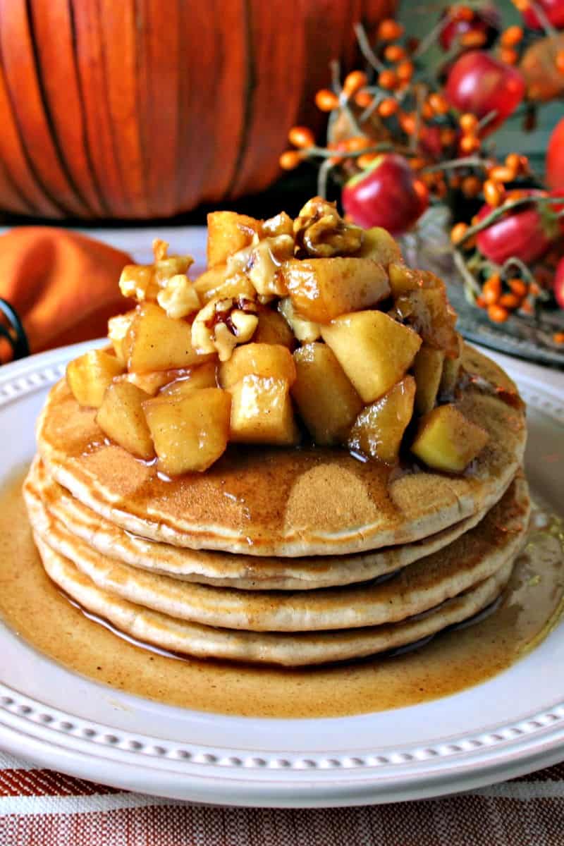 A plate of pancakes on a table, with Apple Cinnamon Pancakes
