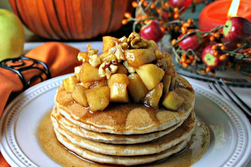 A plate of pancakes on a table, with Apple Cinnamon Pancakes