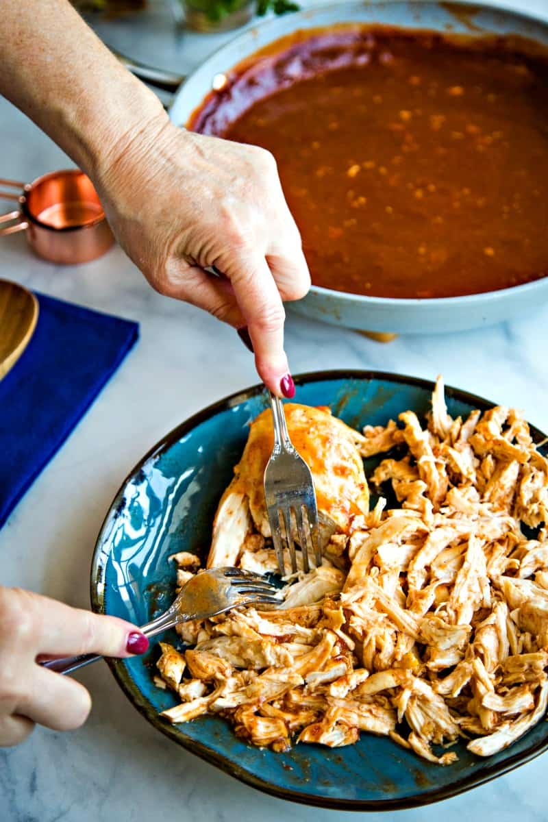 shredding chicken breasts using two forks