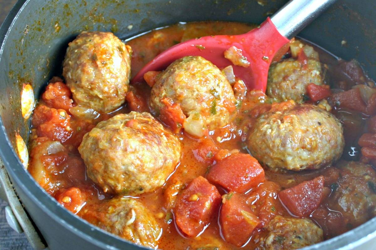 A pan filled with meatballs in sauce