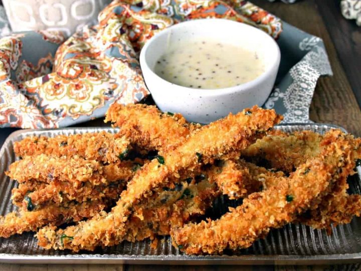 A plate of food on a table, with Portabello Fries with Belchamel Mustard Dipping Sauce
