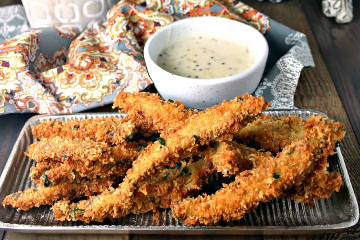 A plate of food on a table, with Portabello Fries with Belchamel Mustard Dipping Sauce
