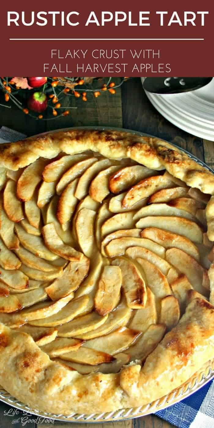 A close up of an apple tart sitting on top of a wooden table