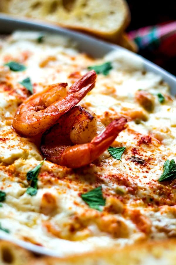 Cheesy Shrimp Dip with two large shrimp as garnish