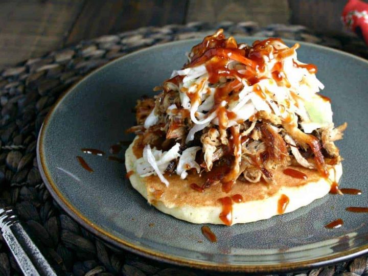A plate of food with a fork, with Redneck Tacos and pulled pork