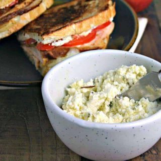 A bowl of food on a plate, with Turkey Stack with Feta Spread