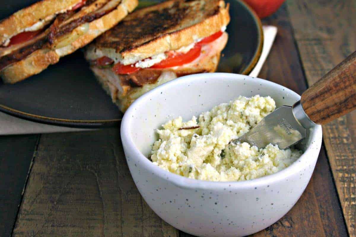 A bowl of food on a plate, with Turkey Stack with Feta Spread
