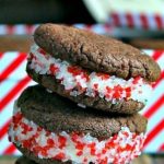 a stack of homemade peppermint oreos on a table with sprinkles
