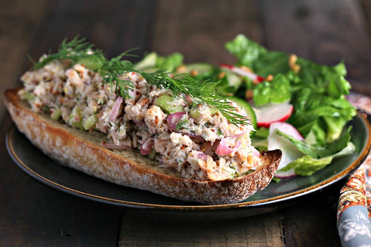 A open face sandwich on a plate, with Smoked Trout Tartine