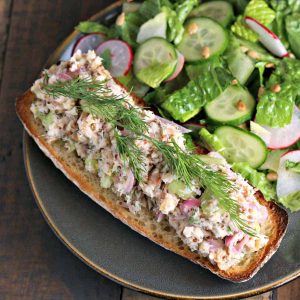 AA open face sandwich on a plate, with Smoked Trout Tartine