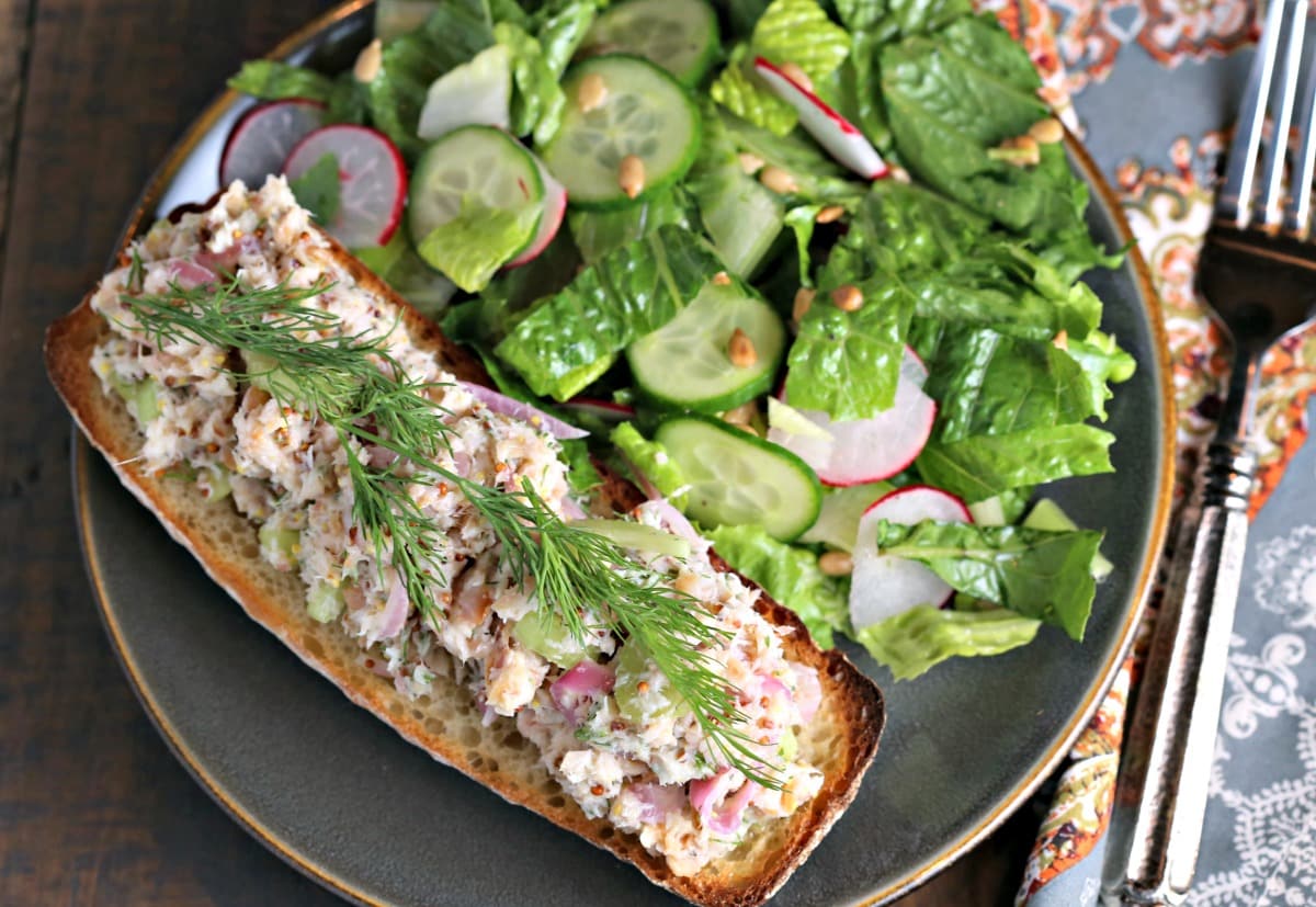 A open face sandwich on a plate, with Smoked Trout Tartine