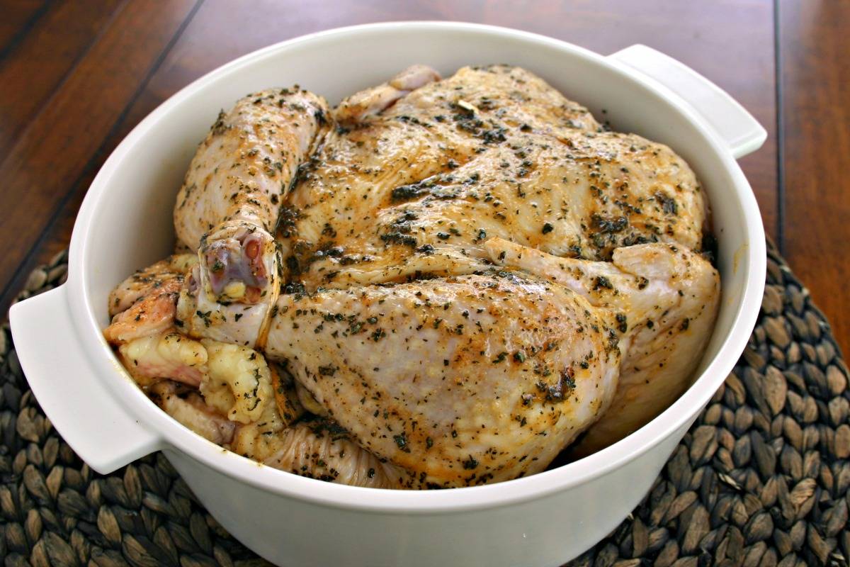 A chicken in a dutch oven, with Sweet Basil Roasted Chicken