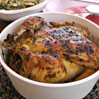 Sweet Basil Roasted Chicken in a Dutch oven on a table