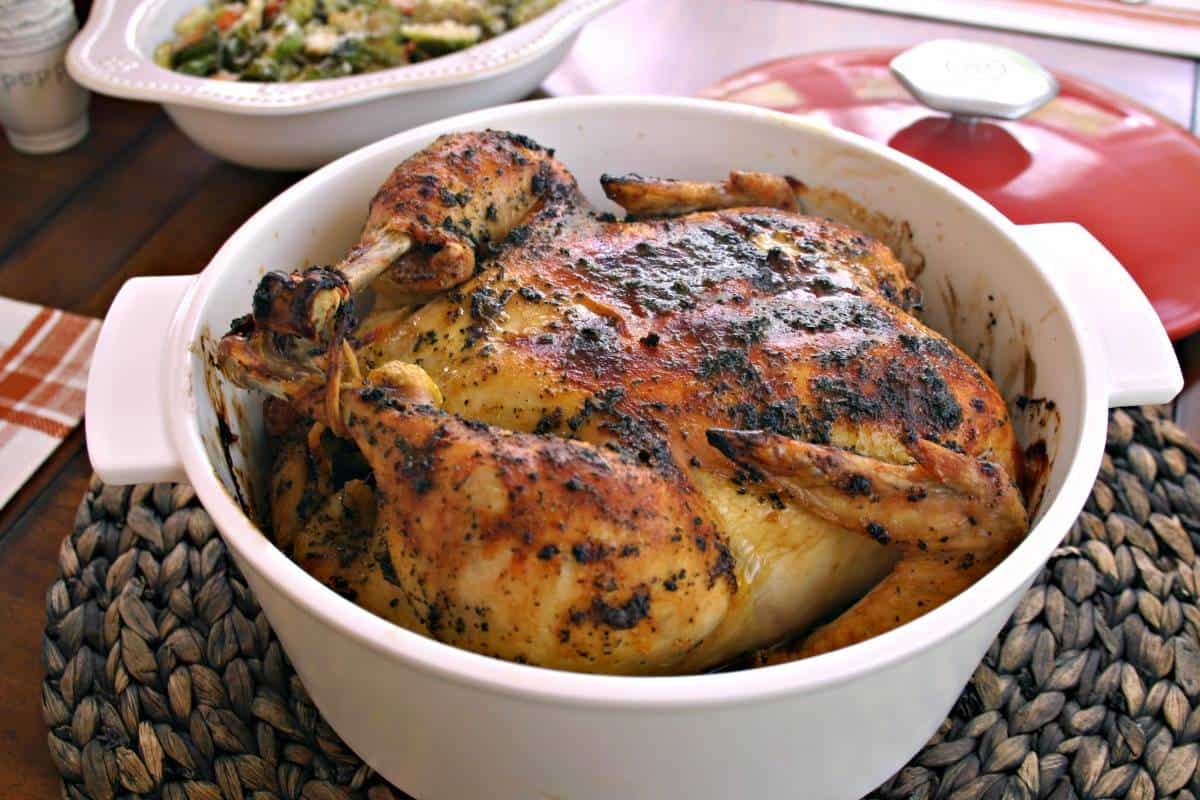 Sweet Basil Roasted Chicken in a Dutch oven on a table